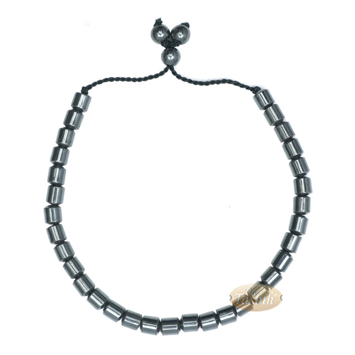Black cylindrical-bead Islamic tasbih bracelet with adjustable cord.