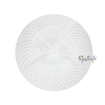 White knitted Islamic prayer cap (kufi) with breathable mesh pattern.